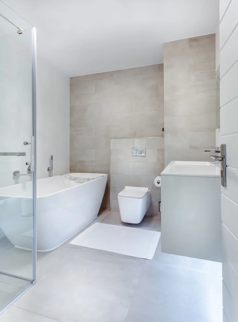 Clean minimalist bathroom with bathtub