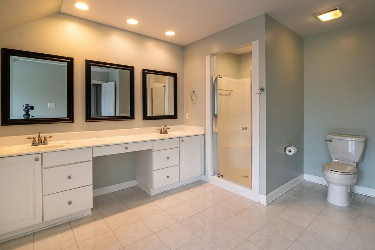 Clean contemporary bathroom with dual sinks
